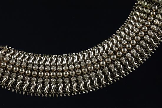 A 20th century Italian gold broad fancy link flexible bracelet, approximately 16cm